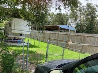 415 5th St, San Leon, TX 77539 - view of yard featuring a fenced backyard