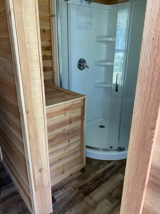 415 5th St, San Leon, TX 77539 - full bathroom with a shower stall and wood finished floors