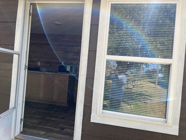 415 5th St, San Leon, TX 77539 - view of exterior entry featuring a sink