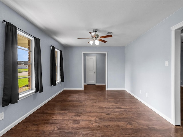 1922 Tracy Lynn Ln, Alvin, TX 77511 - unfurnished room with a ceiling fan, dark wood-style floors, and baseboards