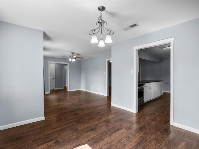 1922 Tracy Lynn Ln, Alvin, TX 77511 - spare room with ceiling fan, dark wood finished floors, baseboards, and a chandelier