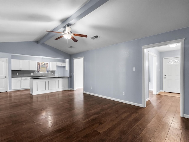 1922 Tracy Lynn Ln, Alvin, TX 77511 - unfurnished living room featuring a ceiling fan, dark wood-type flooring, and baseboards