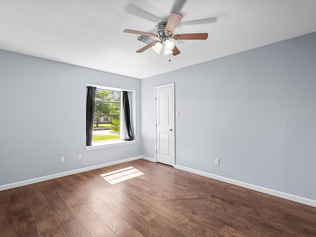 1922 Tracy Lynn Ln, Alvin, TX 77511 - spare room with ceiling fan, baseboards, and dark wood-style flooring