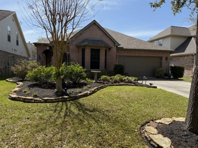 single story home featuring concrete driveway, a front yard, brick siding, and a garage