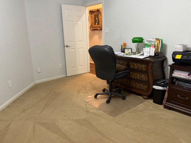 carpeted home office with baseboards