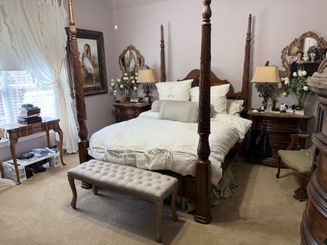 bedroom with light colored carpet