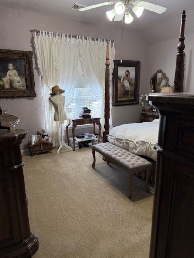 bedroom featuring light colored carpet, vaulted ceiling, a ceiling fan, and visible vents