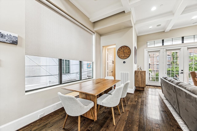 dining room featuring ornamental molding, baseboards, dark wood-type flooring, and beam ceiling