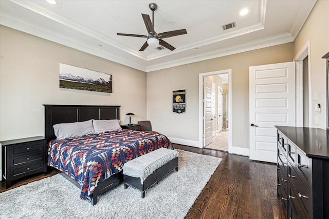 1214 Dunlavy St, Houston, TX 77019 - bedroom with dark wood-style flooring, ornamental molding, a raised ceiling, baseboards, and recessed lighting