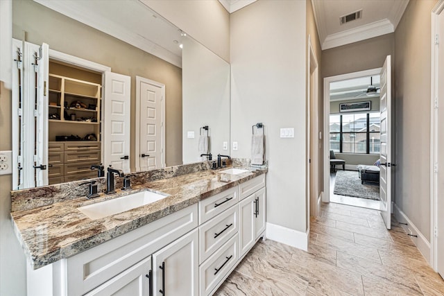 1214 Dunlavy St, Houston, TX 77019 - full bath featuring crown molding, double vanity, baseboards, a spacious closet, and marble finish flooring