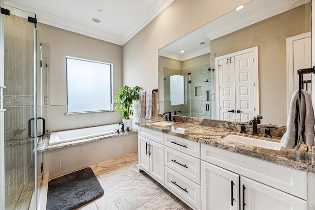 full bathroom with a shower stall, marble finish floor, crown molding, and a sink