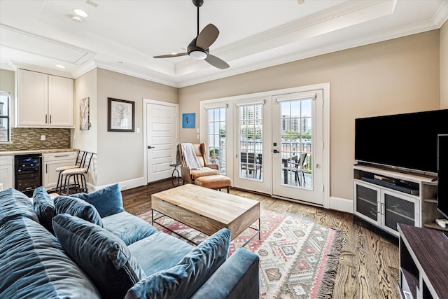 1214 Dunlavy St, Houston, TX 77019 - living area with wine cooler, a tray ceiling, crown molding, ceiling fan, and baseboards