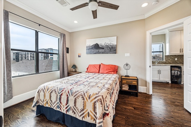 bedroom featuring wine cooler, recessed lighting, crown molding, and visible vents