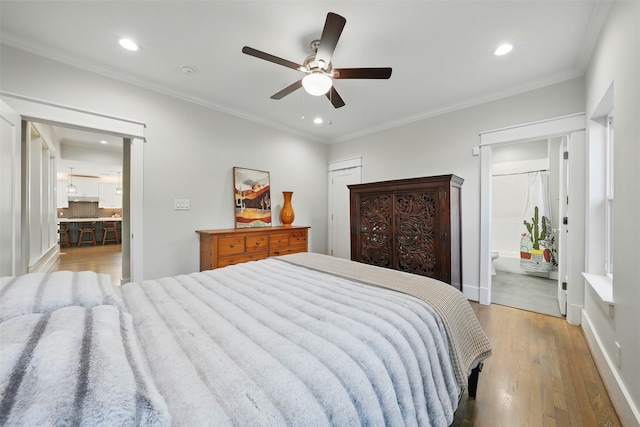 bedroom with light wood-type flooring, recessed lighting, ensuite bathroom, crown molding, and a ceiling fan