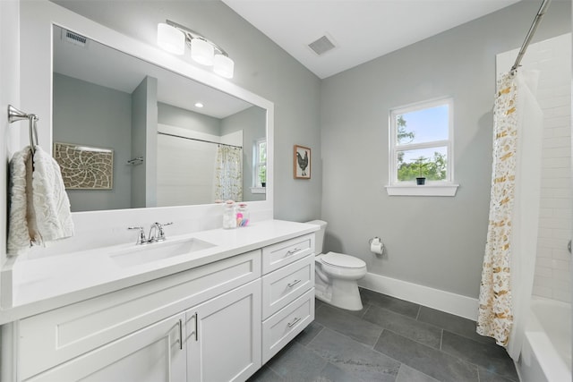 full bathroom featuring baseboards, toilet, and vanity