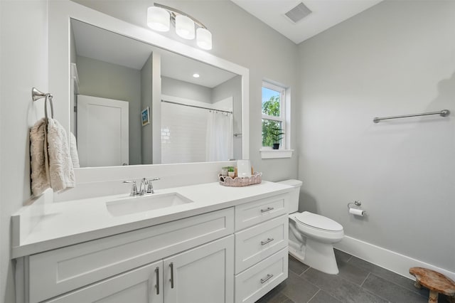 bathroom featuring toilet, baseboards, curtained shower, vanity, and tile patterned floors