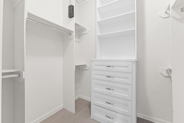 120 Pierce St, Houston, TX 77002 - walk in closet with light tile patterned floors