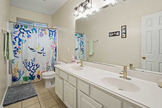 20714 Delta Wood Trl, Humble, TX 77346 - bathroom featuring toilet, tile patterned floors, double vanity, and shower / bath combo with shower curtain