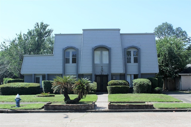 6103 Portal Dr, Houston, TX 77096 - view of property featuring a front lawn and brick siding