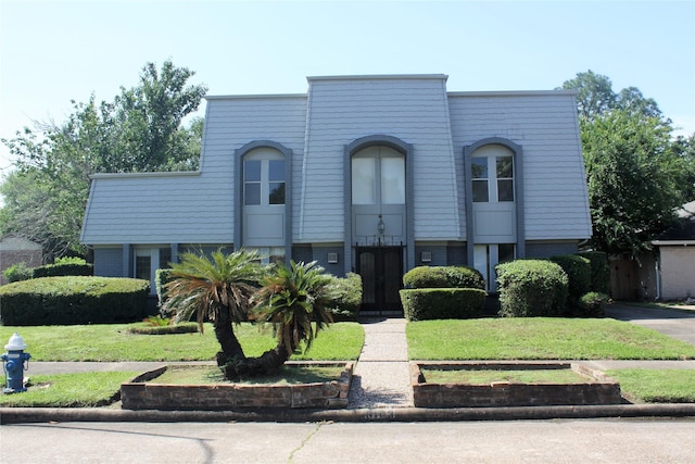 6103 Portal Dr, Houston, TX 77096 - view of front of property with a front lawn and brick siding