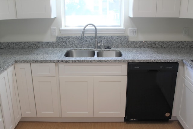 6103 Portal Dr, Houston, TX 77096 - kitchen featuring dishwasher, a sink, white cabinetry, and light stone countertops
