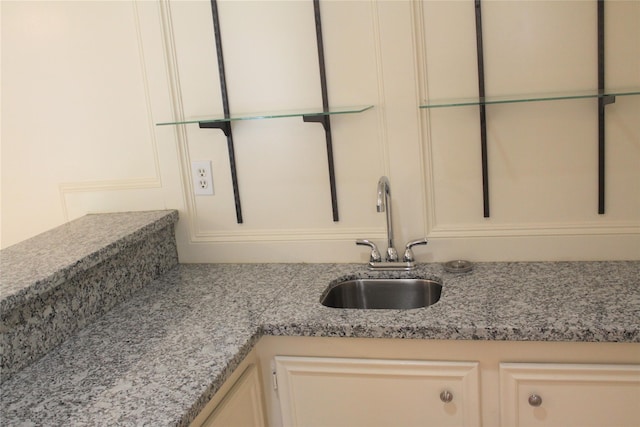6103 Portal Dr, Houston, TX 77096 - detailed view of a sink and light stone countertops
