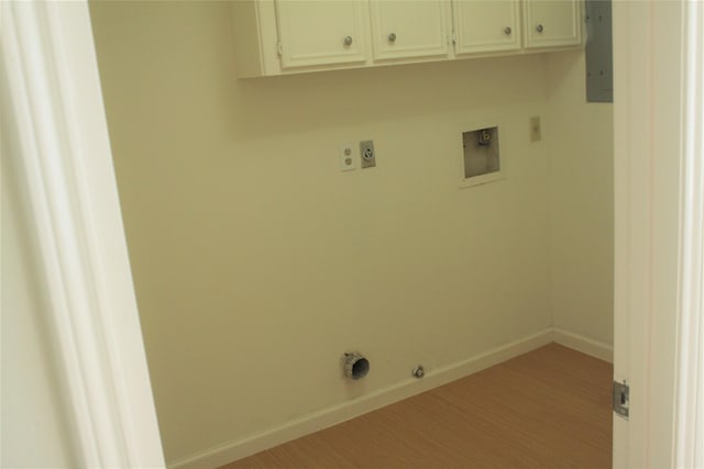 6103 Portal Dr, Houston, TX 77096 - clothes washing area featuring electric dryer hookup, gas dryer hookup, hookup for a washing machine, baseboards, and cabinet space