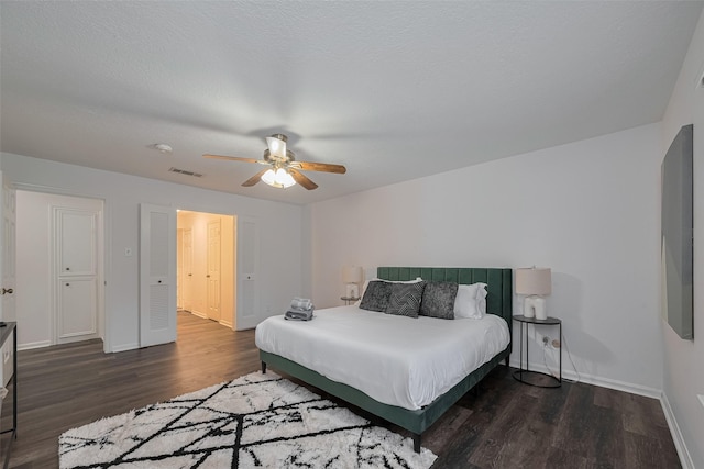 bedroom featuring wood finished floors, baseboards, and ceiling fan