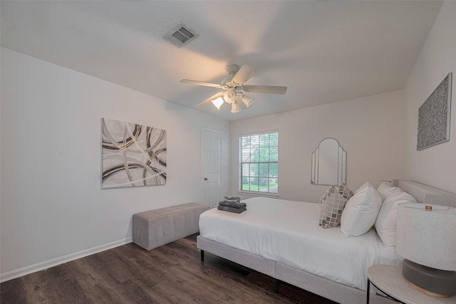 bedroom featuring wood finished floors, ceiling fan, and baseboards
