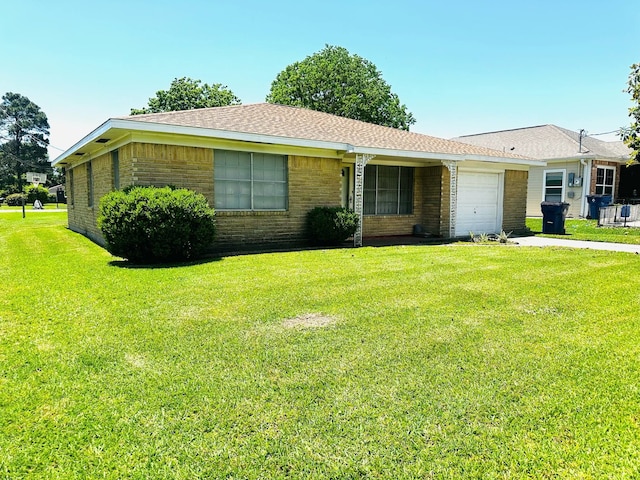 6501 Carver Ave, Texas City, TX 77591 - single story home featuring brick siding, an attached garage, concrete driveway, roof with shingles, and a front lawn