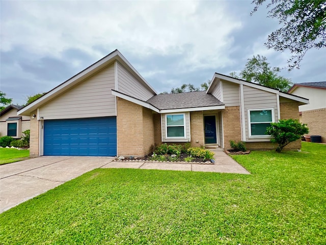 37 Ranch House Loop, Angleton, TX 77515 - mid-century modern home with a front yard, an attached garage, brick siding, and driveway