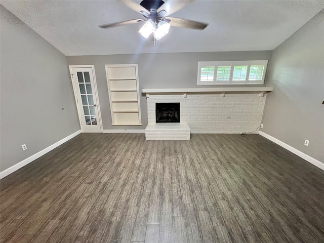 37 Ranch House Loop, Angleton, TX 77515 - unfurnished living room featuring wood finished floors, built in features, baseboards, and ceiling fan