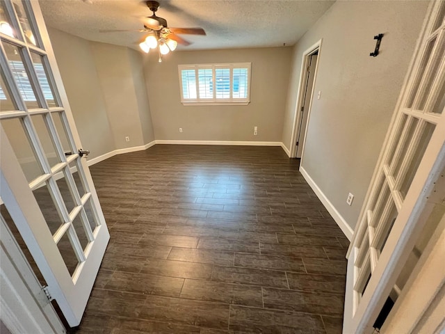 37 Ranch House Loop, Angleton, TX 77515 - unfurnished room with baseboards, dark wood finished floors, ceiling fan, and a textured ceiling