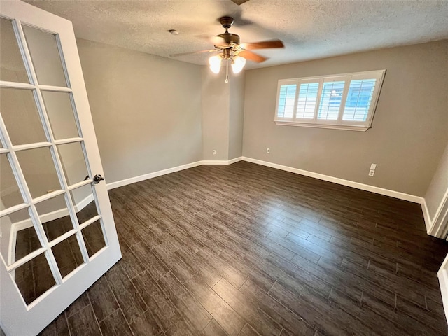 37 Ranch House Loop, Angleton, TX 77515 - empty room featuring a textured ceiling, baseboards, a ceiling fan, and dark wood finished floors