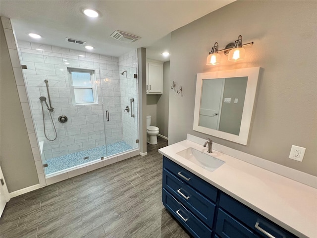 37 Ranch House Loop, Angleton, TX 77515 - full bath with toilet, baseboards, visible vents, a shower stall, and wood finished floors