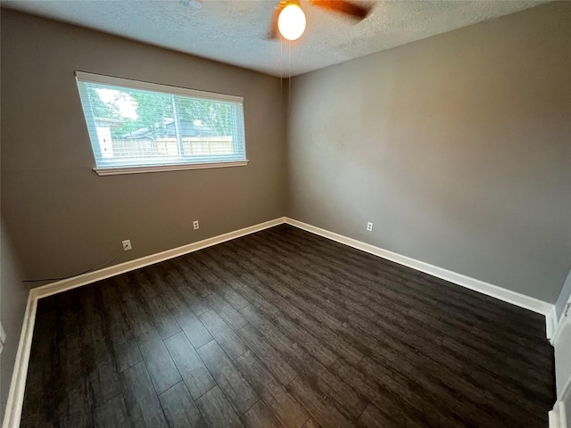 37 Ranch House Loop, Angleton, TX 77515 - spare room with a textured ceiling, dark wood-type flooring, baseboards, and a ceiling fan
