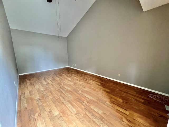 37 Ranch House Loop, Angleton, TX 77515 - empty room featuring vaulted ceiling, baseboards, a ceiling fan, and wood finished floors