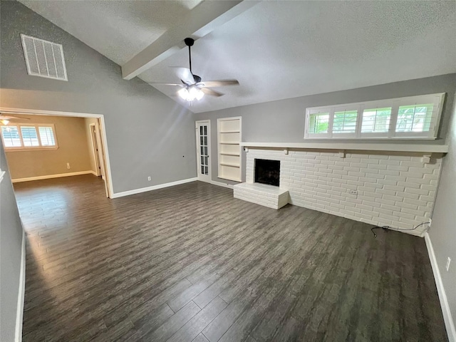 37 Ranch House Loop, Angleton, TX 77515 - unfurnished living room with a textured ceiling, visible vents, ceiling fan, and vaulted ceiling with beams