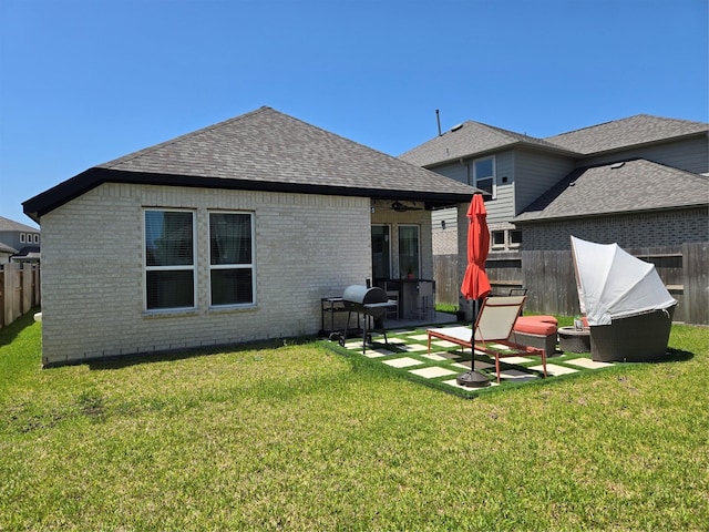 9714 Perdita Trl, Missouri City, TX 77459 - back of house with brick siding, roof with shingles, and a patio area