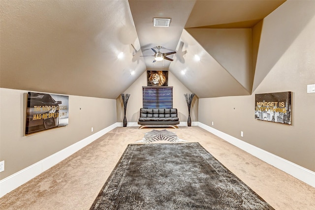 additional living space featuring visible vents, vaulted ceiling, carpet flooring, a ceiling fan, and baseboards
