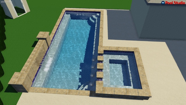 view of swimming pool with a hot tub