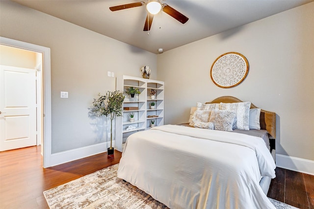 bedroom featuring wood finished floors, baseboards, and ceiling fan