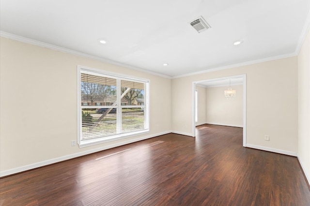 unfurnished room featuring crown molding, dark wood finished floors, visible vents, and baseboards