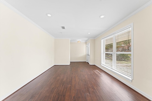 empty room featuring recessed lighting, baseboards, dark wood-style flooring, ornamental molding, and visible vents