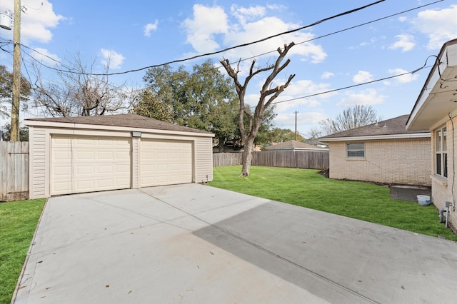 detached garage featuring fence