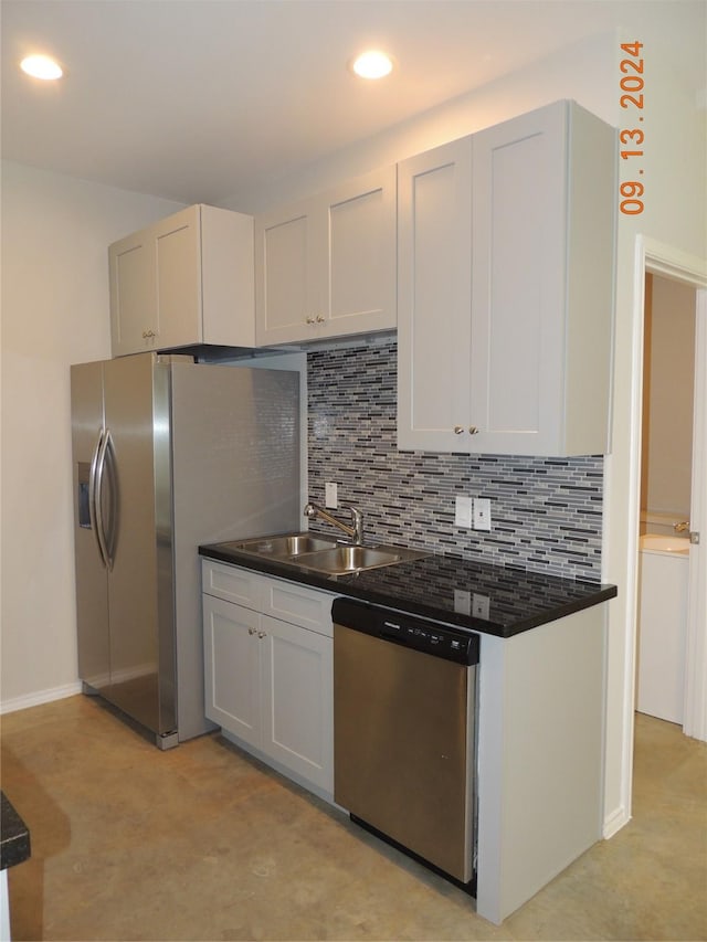 1100 Mann Rd, Conroe, TX 77303 - kitchen featuring recessed lighting, stainless steel dishwasher, a sink, decorative backsplash, and dark countertops