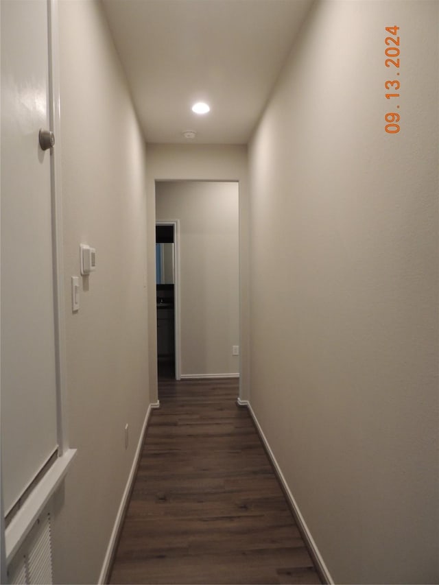 1100 Mann Rd, Conroe, TX 77303 - hallway featuring recessed lighting, baseboards, and dark wood finished floors