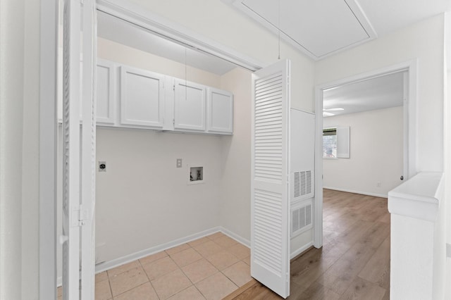 10001 Westpark Dr Unit 7, Houston, TX 77042 - washroom with electric dryer hookup, cabinet space, attic access, hookup for a washing machine, and baseboards