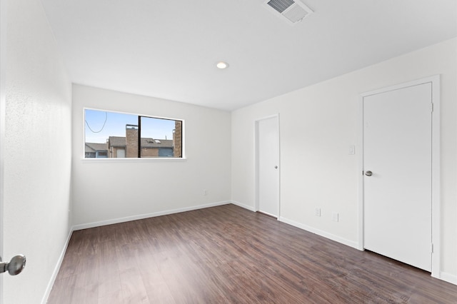 10001 Westpark Dr Unit 7, Houston, TX 77042 - empty room with baseboards, recessed lighting, visible vents, and wood finished floors