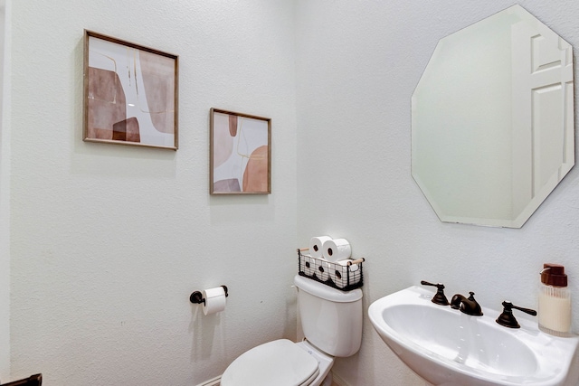 bathroom with a sink and toilet